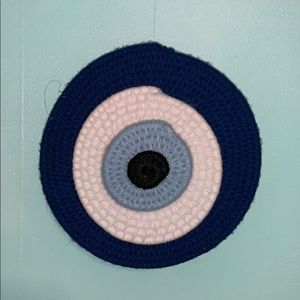 Woven evil eye